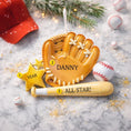 Load image into Gallery viewer, Personalized baseball glove Christmas ornament featuring a tan baseball glove with stitched details, customizable name area on the glove, customizable year star, and customizable text on the baseball bat, glossy finish with raised 3D front details and flat 2D back, white satin hanging ribbon, displayed on a snowy baseball field themed holiday background with baseballs and pine branches.