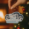 Load image into Gallery viewer, Personalized Big Brother Christmas ornament with custom name and year detail in layered blue and white design. This sibling holiday ornament features raised 3D front lettering and a lightweight flat back, perfect for Christmas tree decor.
