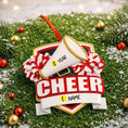 Load image into Gallery viewer, Decorative ornament with a megaphone and pom-poms on a grassy background