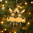 Load image into Gallery viewer, Decorative moose ornament with a banner on a Christmas tree.