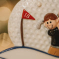 Load image into Gallery viewer, Decorative item with a golfer and number 18 flag on a textured surface