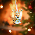 Load image into Gallery viewer, Decorative reindeer ornament with customizable text on a blurred Christmas tree background