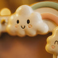 Load image into Gallery viewer, Cute cloud-shaped cookie with a smiling face on a warm-toned background