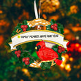 Load image into Gallery viewer, Personalized cardinal wreath ornament featuring a vibrant red cardinal bird surrounded by green holly leaves and red berries. Designed with a smooth glossy finish and a raised 3D front with a flat back for easy hanging. Includes free handwritten personalization with one name and year displayed on the banner at the top. Styled in a warm festive holiday setting with soft Christmas lights candy details and seasonal decor. A meaningful Christmas tree ornament symbolizing remembrance love and connection perfect