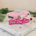 Load image into Gallery viewer, Personalized pink convertible car Christmas ornament with custom name detail and “Best Day Ever” text. This retro style pink car holiday ornament features raised 3D front details and a lightweight flat back design, perfect for Christmas tree décor. A fun keepsake gift for girls, car lovers, birthdays, graduations, or celebrating a special milestone during the holiday season.