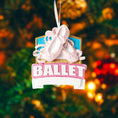 Load image into Gallery viewer, Personalized ballet Christmas ornament featuring soft pink ballet shoes with delicate ribbon details and a glittered ballet banner, customizable name area on the lower front ribbon and customizable year area beside the name, glossy finish with raised 3D front elements and flat 2D back, white hanging ribbon, displayed on a warm snowy holiday background with festive greenery ornaments and cozy Christmas decor.