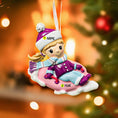 Load image into Gallery viewer, Personalized Christmas ornament of a child on an inner tube with customizable name and year, against a festive background.