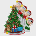 Load image into Gallery viewer, Personalized Christmas ornament with family members around a Christmas tree and presents.