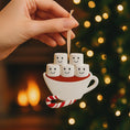 Load image into Gallery viewer, Decorative ornament shaped like a cup with marshmallows and a candy cane against a festive background.