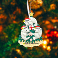 Load image into Gallery viewer, Decorative Christmas ornament with three seals and a gift on a tree, against a blurred Christmas tree background.