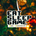 Load image into Gallery viewer, Personalized Eat Sleep Game Christmas ornament with a raised 3D front featuring bold block-style lettering and a detailed game controller icon. The front design is fully three dimensional, creating depth and texture, while the back is flat 2D for easy hanging and durability. White base with black raised letters and subtle colored accents. Includes hand-added personalization with name and year or family name. Gaming-themed holiday ornament displayed on snowy festive background with warm lights, designed for