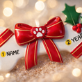 Load image into Gallery viewer, Festive pet themed Christmas ornament designed in a bone shape with a red holiday bow and paw detail. Featuring classic Christmas colors and a warm seasonal background, this ornament adds a joyful and loving touch to pet themed Christmas tree decor. Designed to be personalized with a name and year, making it a meaningful keepsake for pet owners and animal lovers.