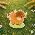 Load image into Gallery viewer, Adorable Highland cow themed Christmas ornament featuring a fluffy brown cow design with soft rounded details and a warm countryside feel. Styled in a natural green meadow setting, this ornament is designed to be personalized and brings a cozy farm inspired charm to holiday tree decor.