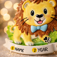 Load image into Gallery viewer, A cute lion themed Christmas ornament designed with a playful and colorful style, perfect for kids and animal lovers. This ornament features a friendly lion character standing on a grassy base with a glossy finish and cheerful details. The design includes a personalization option, allowing a custom name and year to be added, making it a meaningful keepsake for children or family holiday traditions. Ideal for Christmas trees, nursery decor, or as a unique personalized gift for animal themed celebrations.