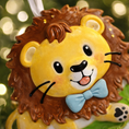 Load image into Gallery viewer, A cute lion themed Christmas ornament designed with a playful and colorful style, perfect for kids and animal lovers. This ornament features a friendly lion character standing on a grassy base with a glossy finish and cheerful details. The design includes a personalization option, allowing a custom name and year to be added, making it a meaningful keepsake for children or family holiday traditions. Ideal for Christmas trees, nursery decor, or as a unique personalized gift for animal themed celebrations.