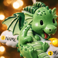 Load image into Gallery viewer, green dragon ornament designed with a fully sculpted 3D front that showcases raised details and expressive features, paired with a smooth 2D flat back for lightweight hanging. The glossy finish enhances the depth of the front design while keeping the back clean and minimal. Personalized name and year placement are clearly visible, making this dragon ornament a magical keepsake and a charming addition to holiday decor or fantasy themed collections.