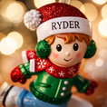 Load image into Gallery viewer, This personalized ice skating boy ornament features a cheerful winter skater wearing festive holiday clothing and gliding across an icy base. The design includes a custom name on the hat and a year displayed on the base, making it a perfect keepsake for celebrating winter memories, first Christmas moments, or a child’s love for ice skating and winter sports.
