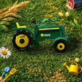 Load image into Gallery viewer, Green tractor ornament featuring a classic farm tractor design with a deep green glossy finish and yellow wheel details. The ornament includes free handwritten personalization with one name and one year, making it a meaningful keepsake for farm families and tractor loving children. Inspired by country life and rural traditions, this ornament is perfect for farmhouse Christmas decor and personalized holiday displays.