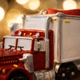Load image into Gallery viewer, Red semi truck ornament featuring a classic delivery truck design with a glossy red cab and white trailer. The ornament includes free handwritten personalization with a name and year, making it a meaningful keepsake for truck drivers, transportation families, and kids who love big trucks. Clean front facing design with smooth resin finish, perfect for Christmas tree decor and holiday displays.
