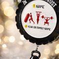 Load image into Gallery viewer, Personalized weightlifting and fitness Christmas ornament featuring a raised 3D front with bold circular design and red strength icons including boxing, gymnastics rings, and weightlifting. The ornament has a textured black outer rim and a flat 2D back for easy hanging. Includes a hanging kettlebell charm for added depth and movement. Hand-added personalization allows a name and year or family name. Photographed on a festive Christmas tree background with warm holiday lights.