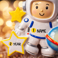 Load image into Gallery viewer, Personalized astronaut Christmas ornament featuring a detailed 3D front design with a smiling space explorer holding a colorful planet and bright yellow stars. The childâs name is added on the suit and the year is written on the star for a custom touch. This space themed ornament is perfect for kids who love rockets, planets, and outer space dreams. A fun and meaningful holiday keepsake for future astronauts and little space lovers.