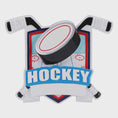 Load image into Gallery viewer, Personalized hockey Christmas ornament featuring a hockey puck and crossed hockey sticks design, customizable name area on the front banner and customizable year area on the puck, glossy finish with raised 3D front details and flat 2D back, white hanging ribbon, displayed on a snowy ice rink themed holiday background with hockey accessories and festive winter decorations.