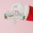 Load image into Gallery viewer, Decorative ornament with 'Godmother' text held by a Santa Claus glove on a pink background