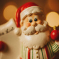 Load image into Gallery viewer, Decorative Santa Claus figurine with a blurred light background