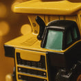 Load image into Gallery viewer, Close-up of a truck ornament with a yellow and black color scheme.