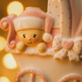 Load image into Gallery viewer, Personalized baby girl Christmas ornament featuring a soft pink stroller with glitter details and a smiling baby wearing a pink nightcap. Custom name appears on the top and year on the bottom, making it a perfect Baby’s First Christmas keepsake. This pink resin holiday ornament is ideal for newborn girls, baby shower gifts, and celebrating a special first Christmas memory.