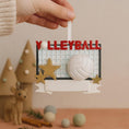 Load image into Gallery viewer, Decorative ornament with 'Volleyball' text and net design, held by a hand.