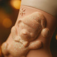 Load image into Gallery viewer, Close-up of a baby bear ornament figurine with glittery texture against a blurred background