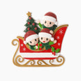 Load image into Gallery viewer, Christmas ornament with three children in a sleigh, tree, and presents on a white background