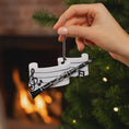 Load image into Gallery viewer, Hand holding a clarinet ornament with music notes against a Christmas tree and fireplace background