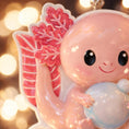 Load image into Gallery viewer, Cute baby dragon figurine with a blurred lights background