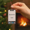 Load image into Gallery viewer, Phone-shaped ornament with 'Samantha' and 'Year' text, held by a hand against a festive background.