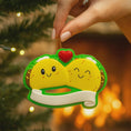 Load image into Gallery viewer, Personalized taco couple ornament featuring a playful and colorful design celebrating love and togetherness. This cute Christmas ornament can be customized with two names and a family name or year, making it perfect for couples, partners, newlyweds, engagements, anniversaries, Valentine’s Day, or fun holiday gifts. A joyful keepsake that represents shared laughter, connection, and memorable moments together.