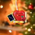 Load image into Gallery viewer, Decorative ornament shaped like a heart with educational elements on a green background with snowflakes and teacher Christmas ornament