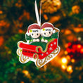 Load image into Gallery viewer, Personalized couple ornament featuring two characters sitting together in a festive sleigh design. This romantic Christmas ornament can be customized with two names and a year or family name, making it perfect for couples, partners, spouses, fiancés, or loved ones. Ideal for celebrating love, togetherness, Valentine’s Day, anniversaries, or first holidays together. A meaningful keepsake for couples who want to turn shared moments into lasting holiday memories.