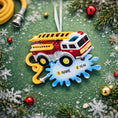 Load image into Gallery viewer, Fire truck ornament with customizable name and age on a green background with Christmas decorations.