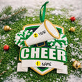 Load image into Gallery viewer, Decorative ornament for a cheerleader with a megaphone and pom-poms on a grassy background.