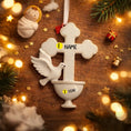 Load image into Gallery viewer, Decorative cross ornament with a dove on a wooden background with Christmas lights and decorations.