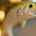 Load image into Gallery viewer, Close-up of a ceramic fish figurine with a blurred background