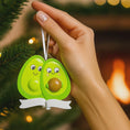 Load image into Gallery viewer, Personalized expecting couple ornament featuring a cute avocado couple design celebrating pregnancy and growing families. This joyful Christmas ornament can be customized with two names and a year, making it perfect for pregnancy announcements, expecting parents, baby reveals, and first Christmas as a family. A playful and heartwarming keepsake that captures love, excitement, and the beginning of a beautiful new chapter together.