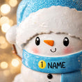 Load image into Gallery viewer, Personalized Snowman Baby Christmas Ornament featuring a cheerful snowman with blue glitter hat and scarf, holding a sparkling ornament. This design has a raised 3D front with textured details, dimensional elements, and vibrant winter colors. The child’s name is placed on the scarf and the year is added below. A perfect keepsake for baby’s first Christmas, newborn gift, winter holiday decoration, and meaningful family tree memory ornament.