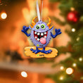 Load image into Gallery viewer, Colorful monster ornament with customizable name and age on a Christmas tree.