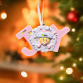Load image into Gallery viewer, Decorative Christmas ornament with baby face and 'JOY' letters against a festive background.