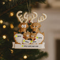 Load image into Gallery viewer, Reindeer family ornament with customizable names on a Christmas tree.