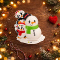 Load image into Gallery viewer, Decorative snowman with penguins on a wooden surface with festive decorations.