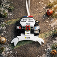 Load image into Gallery viewer, Personalized police car Christmas ornament featuring a black and white cop car design with BUSTED text, police lights and festive wreath detail. Customized with a name and year on the front banner. Glossy resin finish with bold black and white colors creates a fun and playful holiday look. Mostly 2D ornament with raised 3D details on the front only, lightweight and perfect for Christmas tree decor and police themed gifts.
